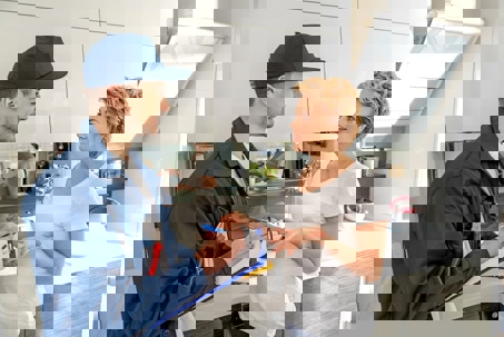 woman talking to the technician